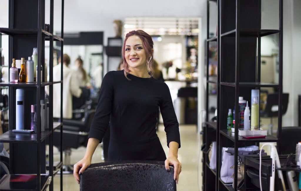 woman standing behind a salon chair