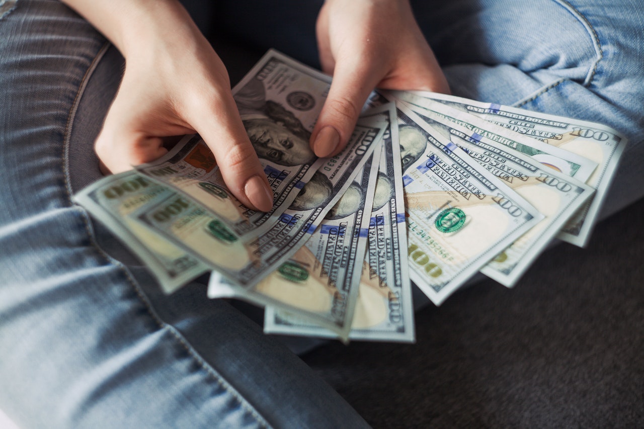 woman holding dollar bills