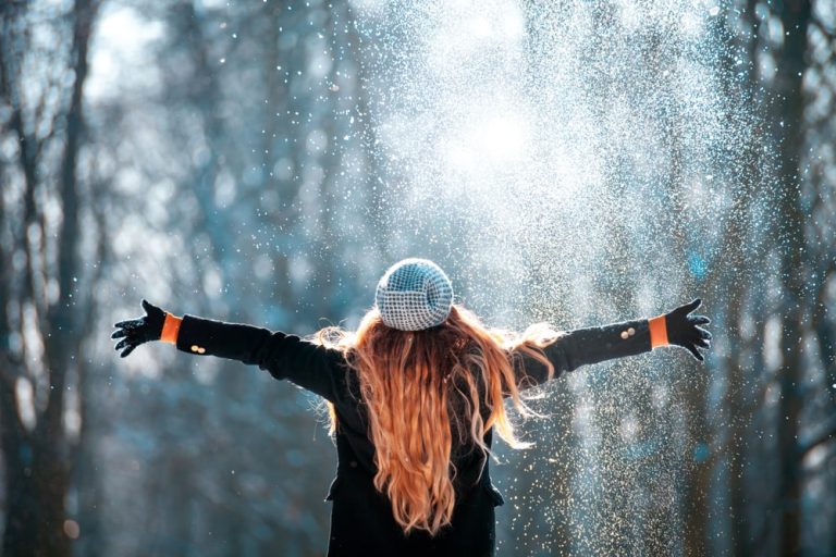 woman in the snow with pretty red hair