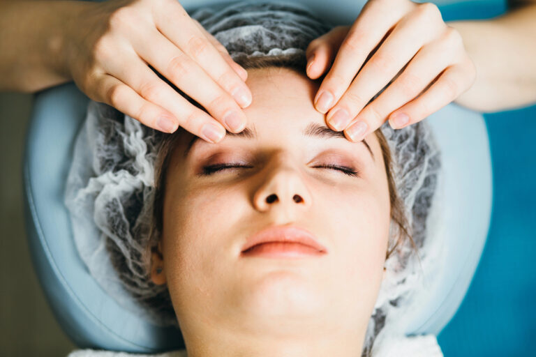 Woman receiving facial treatment at Austin Kade Academy in East Idaho.