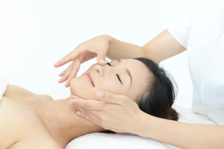 Esthetician performing facial treatment on client in Idaho.