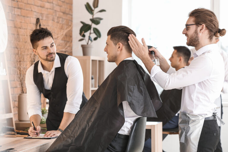 Barber student getting haircut training at Austin Kade Academy.