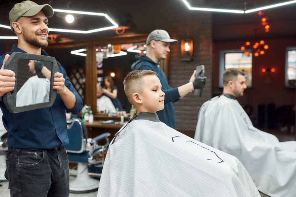 Students practicing barbering techniques at Austin Kade Academy in idaho falls