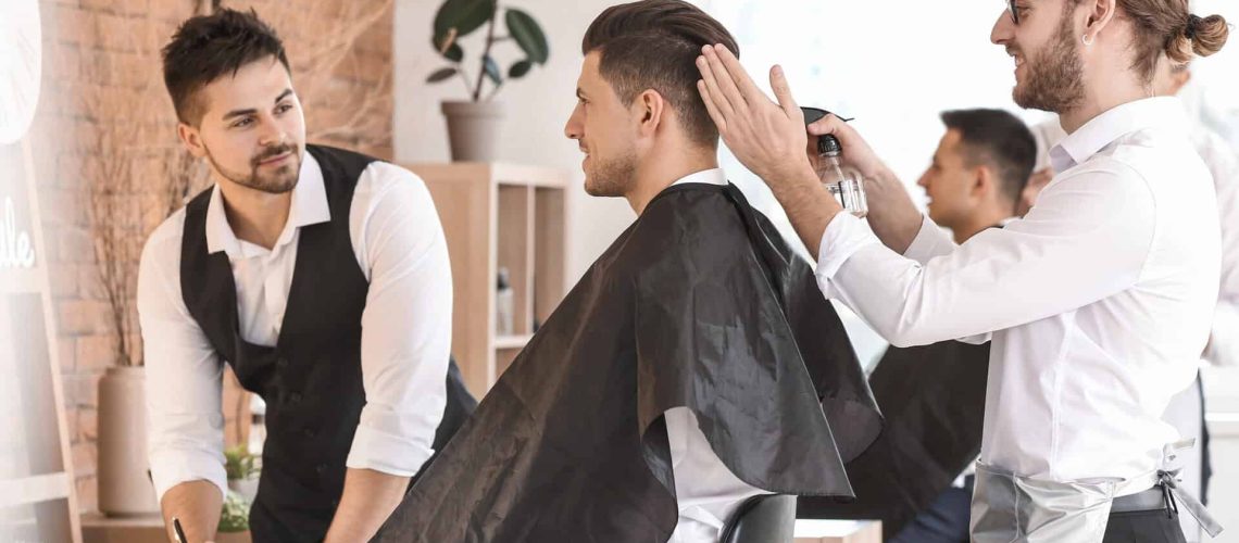 Barber student getting haircut training at Austin Kade Academy.
