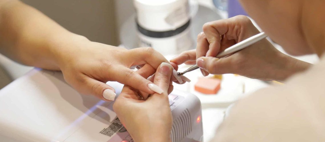 Nail technician training session at Austin Kade Academy, focusing on professional nail art and manicure