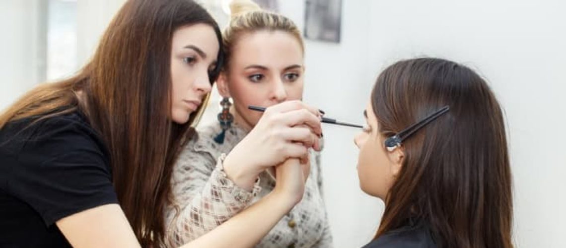 Makeup artist training session at Austin Kade Academy for aspiring east idaho beauty professionals