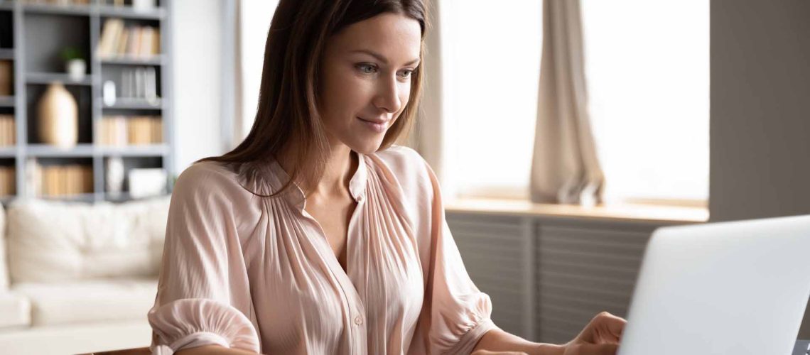 Woman studying online at home using laptop for education and skill development in east idaho