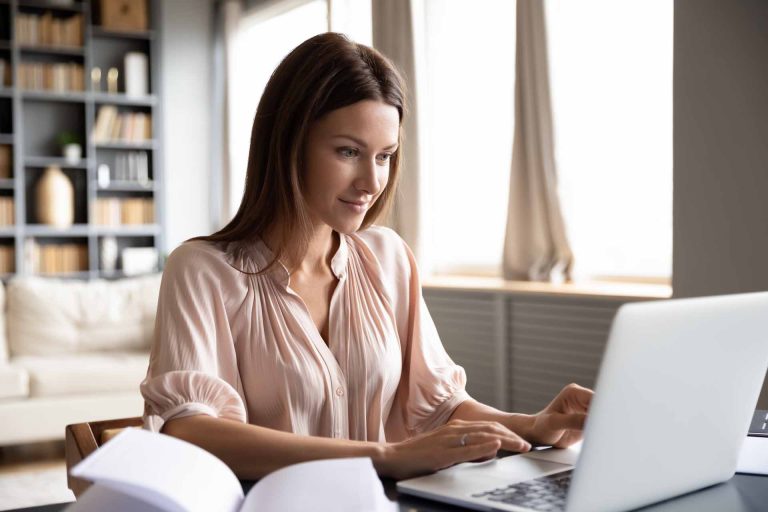 Woman studying online at home using laptop for education and skill development in east idaho